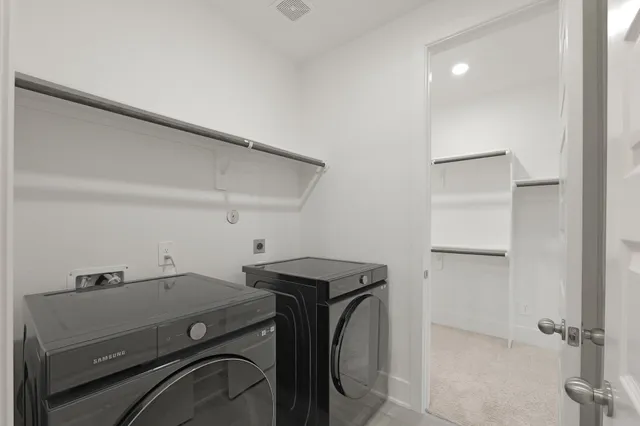 a utility room with dryer and washer