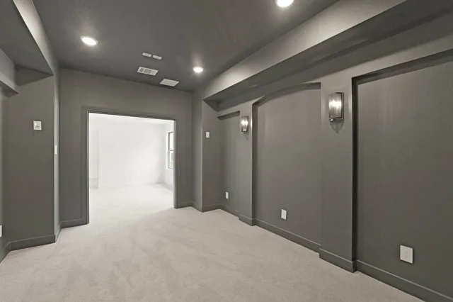 en empty room with closet and bathroom