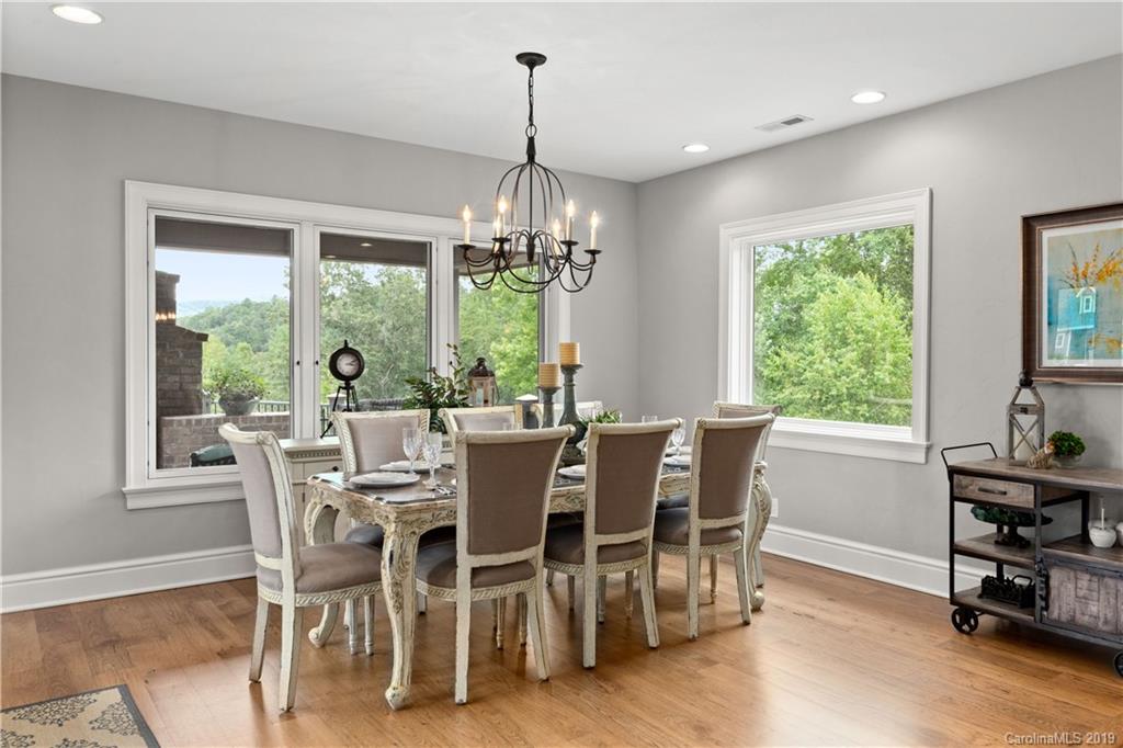 65 Waterhill Way Fletcher, NC 28732 - Photo 22 of 48 a view of a dining room with furniture window and outside view