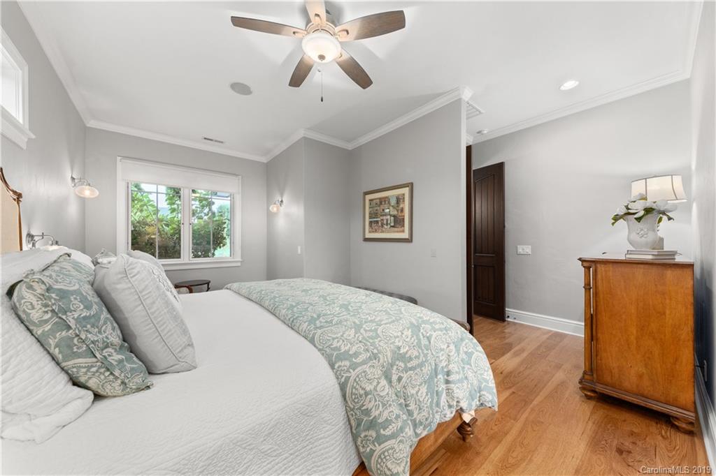 65 Waterhill Way Fletcher, NC 28732 - Photo 30 of 48 a bedroom with a large bed and a window