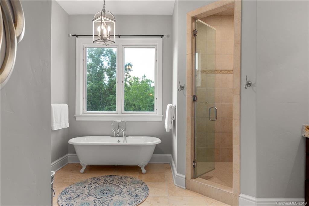 65 Waterhill Way Fletcher, NC 28732 - Photo 31 of 48 a spacious bathroom with a bathtub and sink