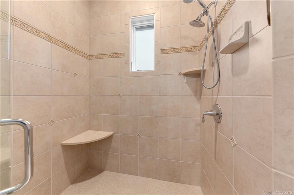 65 Waterhill Way Fletcher, NC 28732 - Photo 34 of 48 a bathroom with a toilet and shower