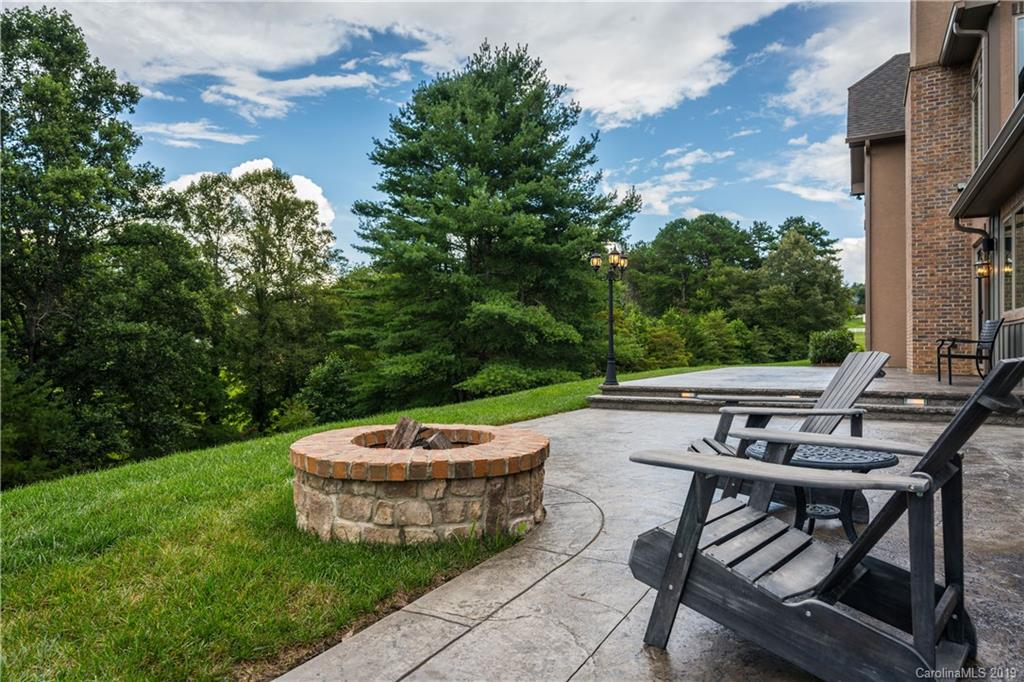 65 Waterhill Way Fletcher, NC 28732 - Photo 8 of 48 a view of a patio with couple of chairs in front of house