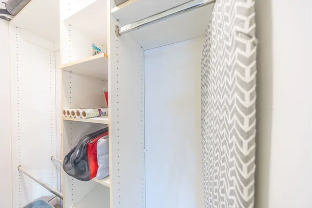 a bathroom with a shower and a curtain