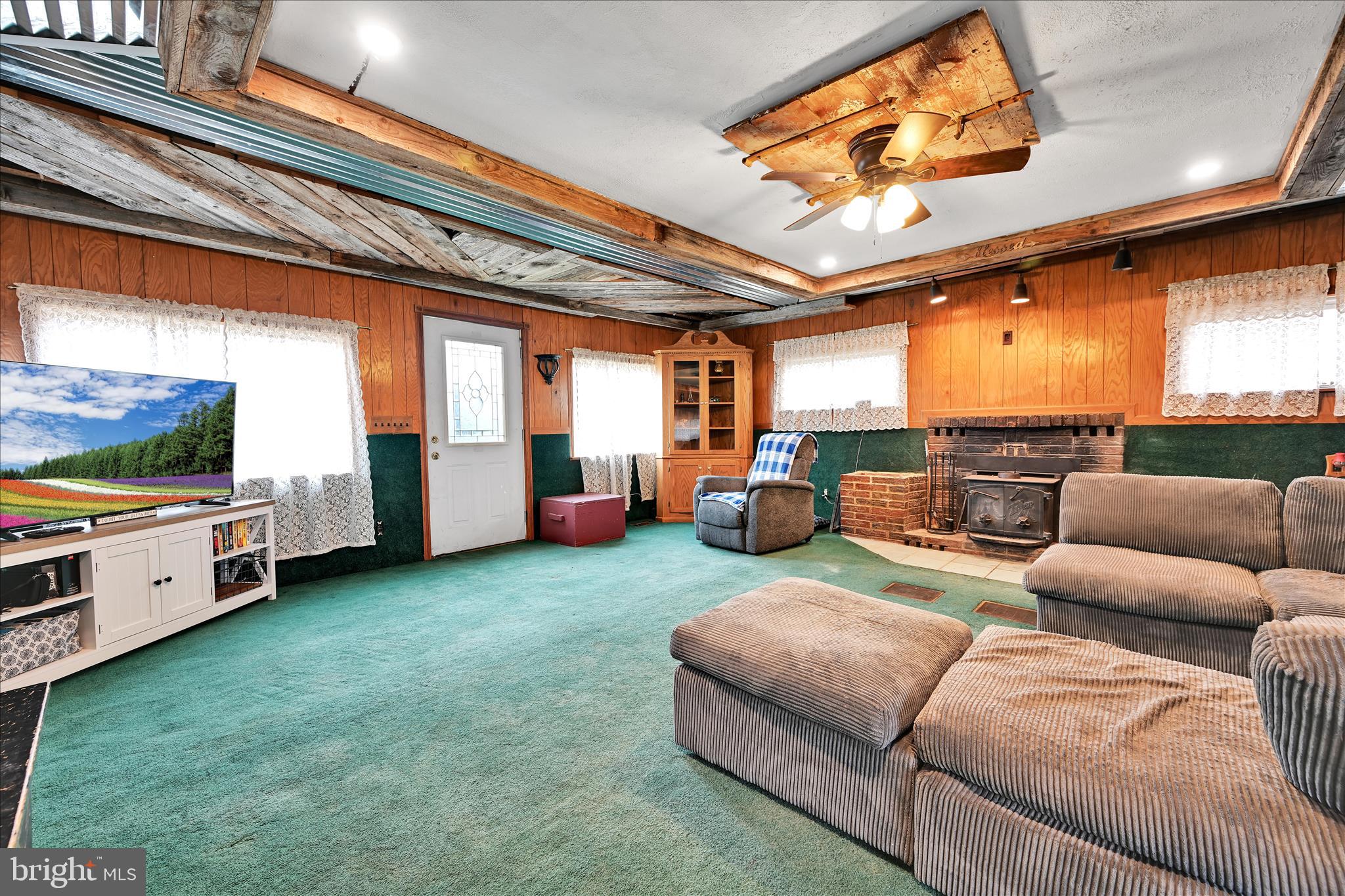 389 Sweet Arrow Lake Road Pine Grove, PA 17963 - Photo 25 of 59 a living room with furniture and a flat screen tv