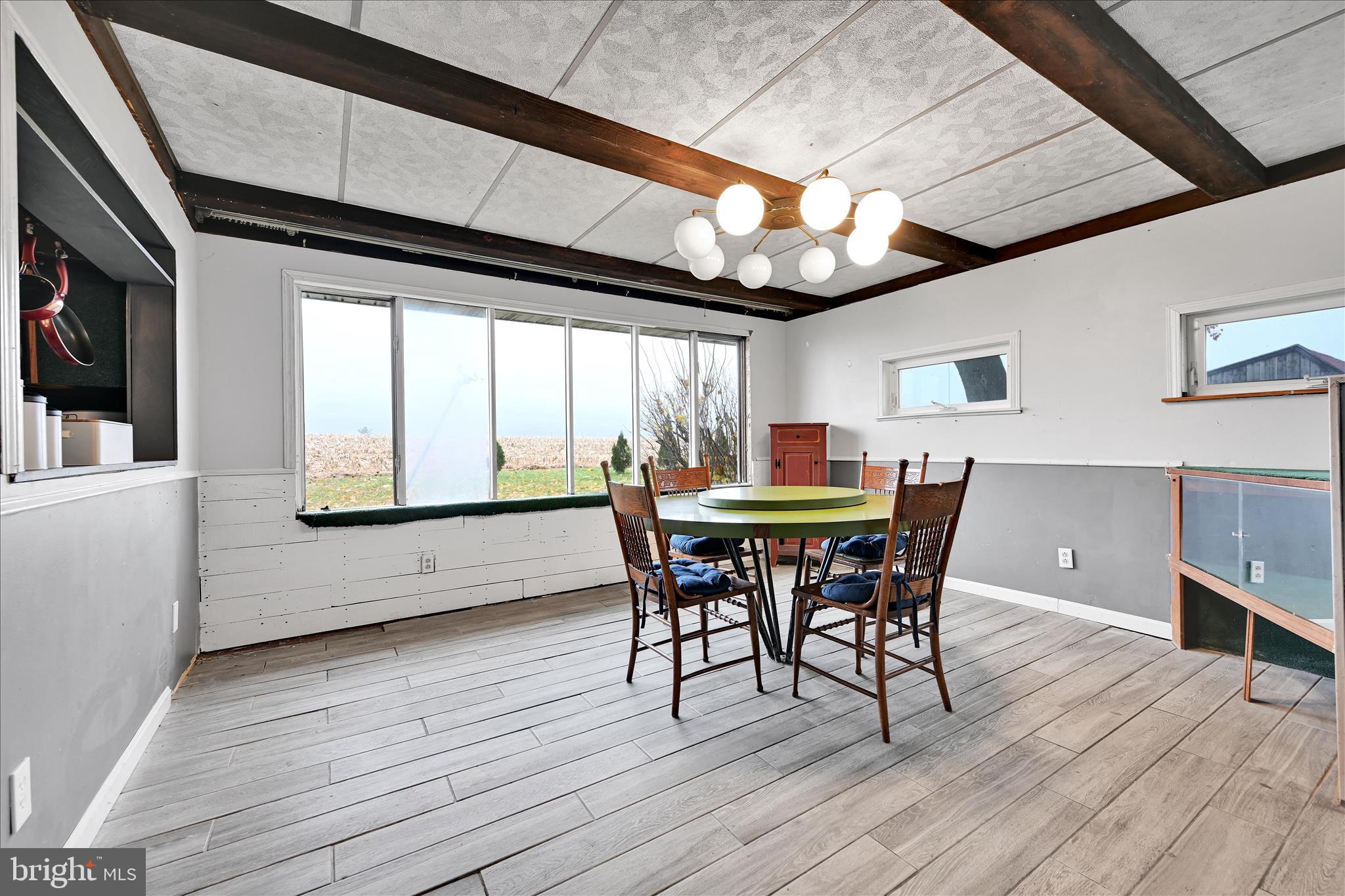 389 Sweet Arrow Lake Road Pine Grove, PA 17963 - Photo 29 of 59 a dining room with furniture and wooden floor
