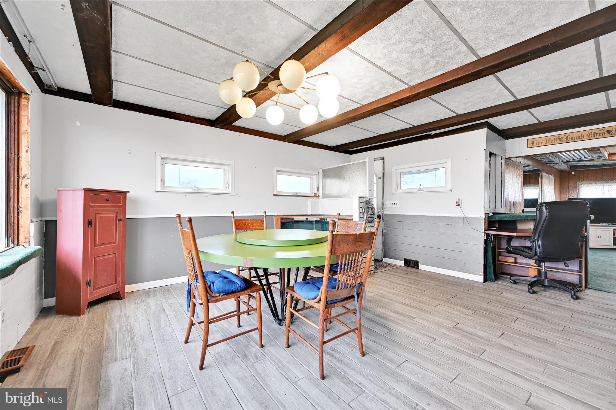 389 Sweet Arrow Lake Road Pine Grove, PA 17963 - Photo 30 of 59 a view of a dining room with furniture and wooden floor
