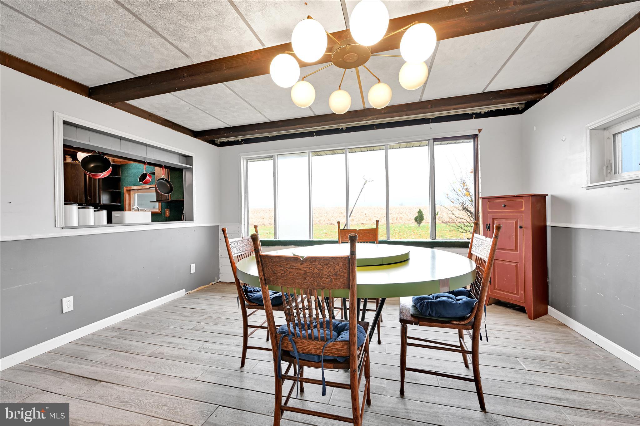 389 Sweet Arrow Lake Road Pine Grove, PA 17963 - Photo 31 of 59 a view of a dining room with furniture window and outside view