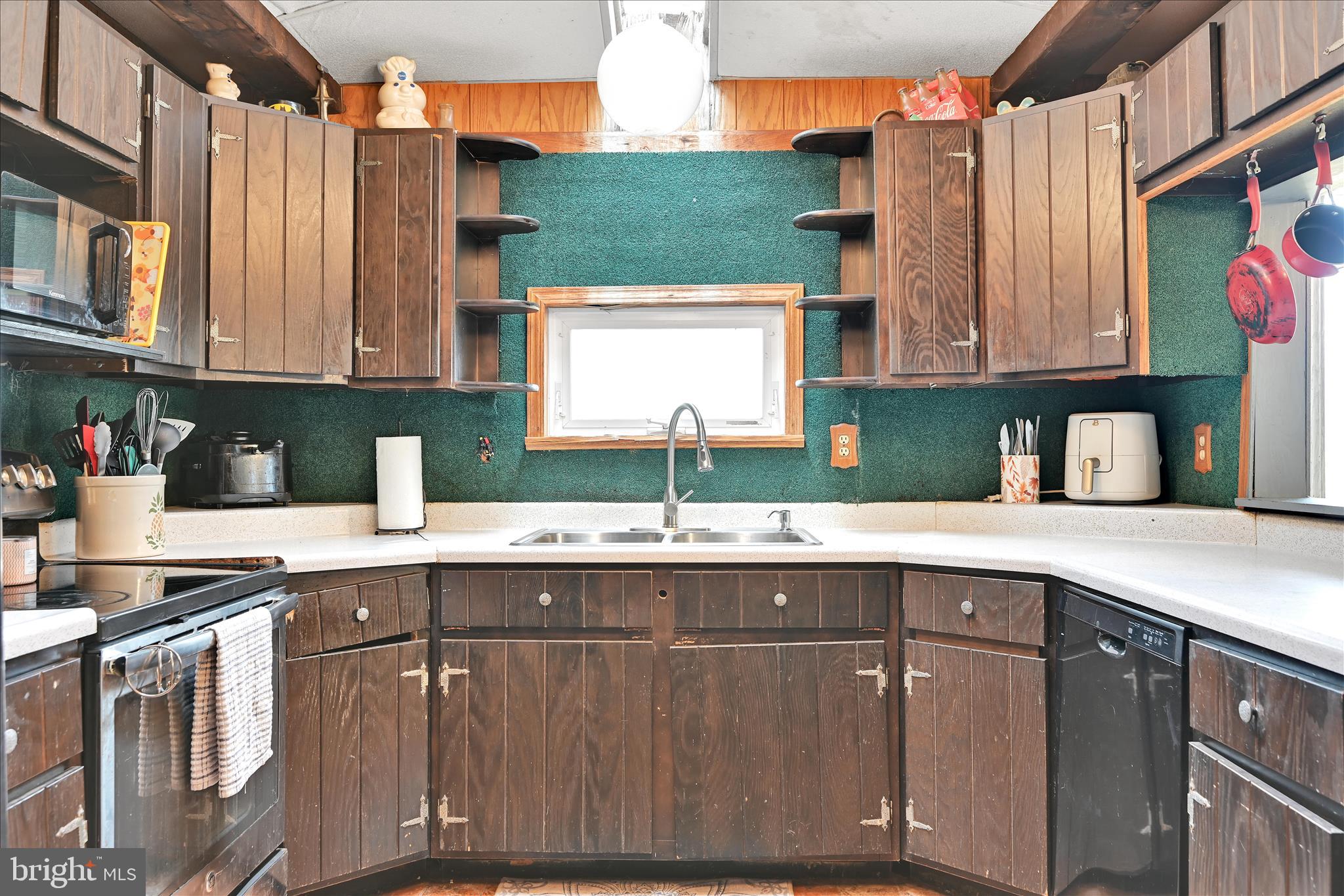 389 Sweet Arrow Lake Road Pine Grove, PA 17963 - Photo 35 of 59 a kitchen with a sink window and cabinets