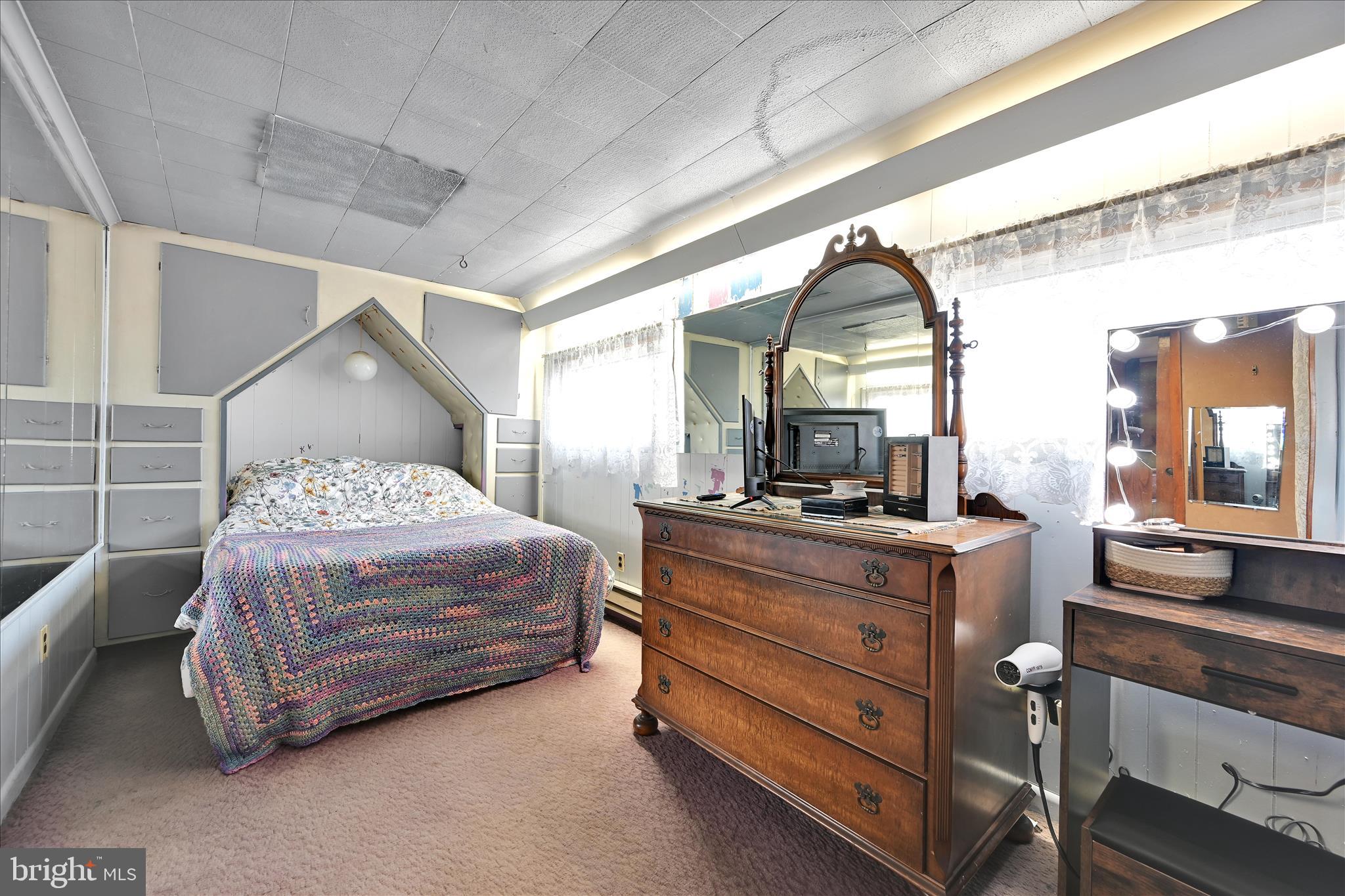 389 Sweet Arrow Lake Road Pine Grove, PA 17963 - Photo 36 of 59 a bedroom with a bed and a large window