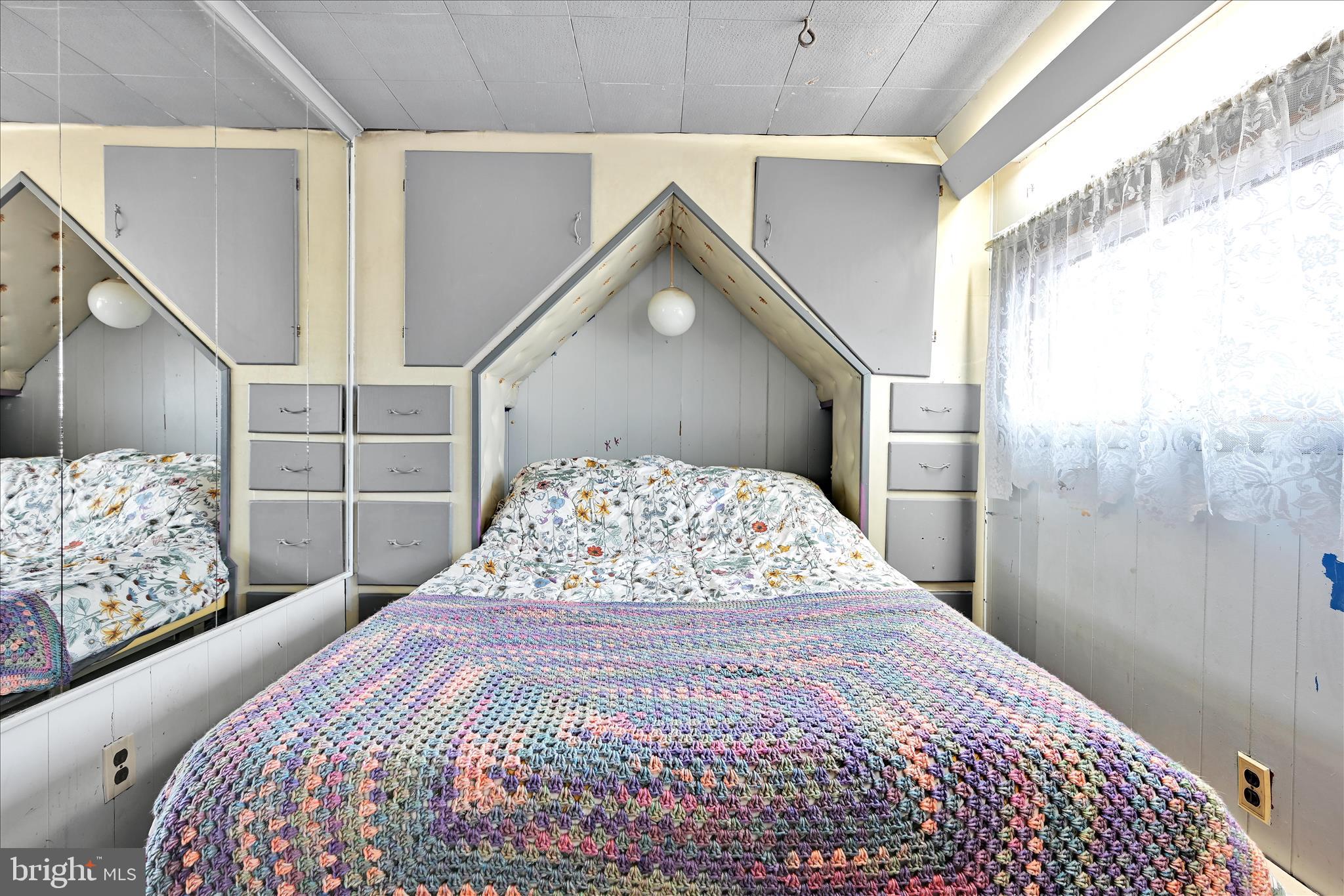 389 Sweet Arrow Lake Road Pine Grove, PA 17963 - Photo 37 of 59 a bedroom with a large bed and a window