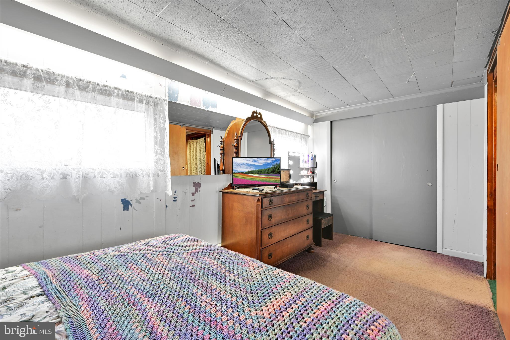 389 Sweet Arrow Lake Road Pine Grove, PA 17963 - Photo 38 of 59 a bedroom with a bed and a dresser