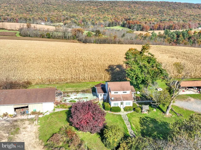 an aerial view of a house with a lake view