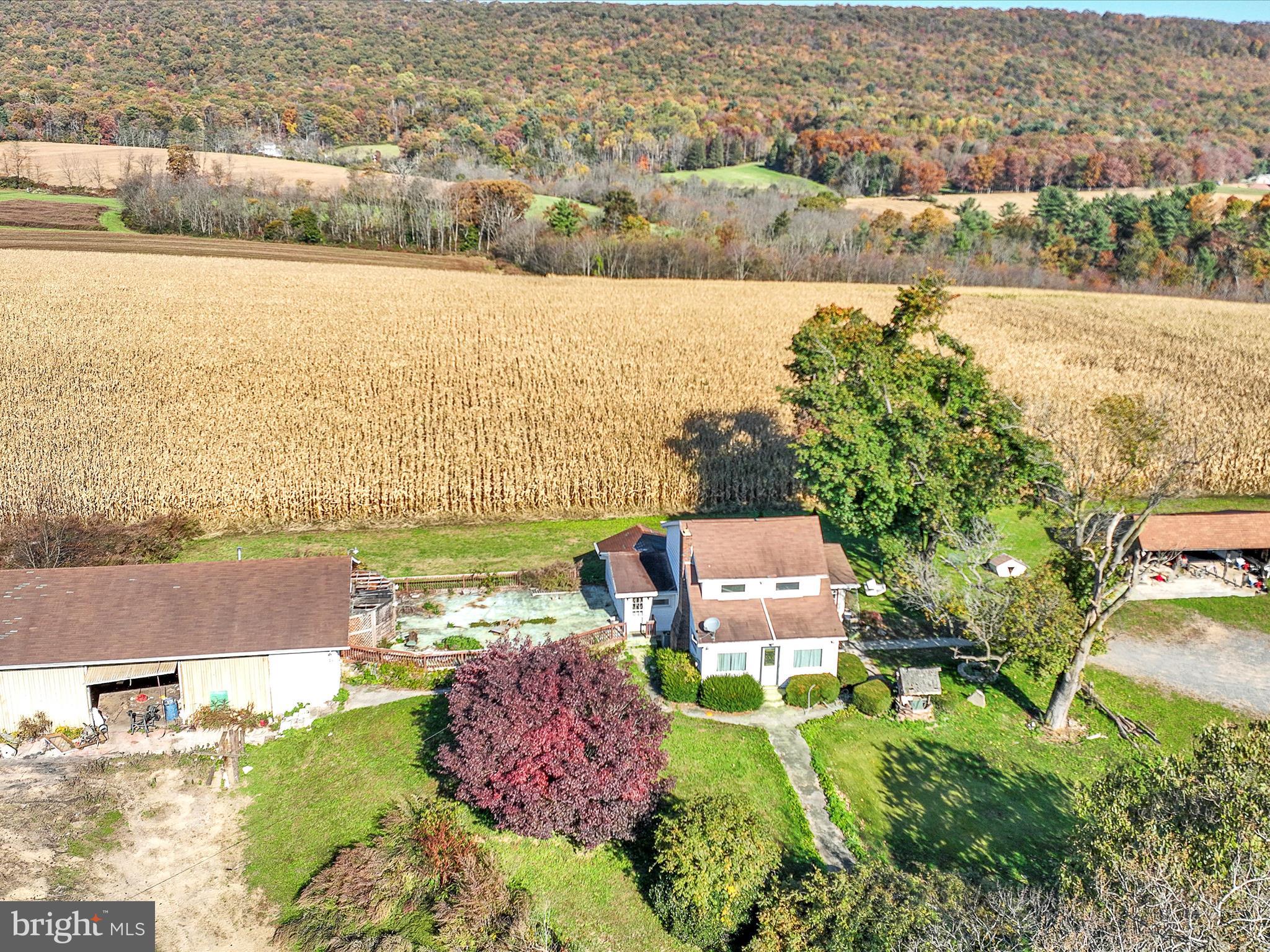 389 Sweet Arrow Lake Road Pine Grove, PA 17963 - Photo 4 of 59 an aerial view of a house with a lake view
