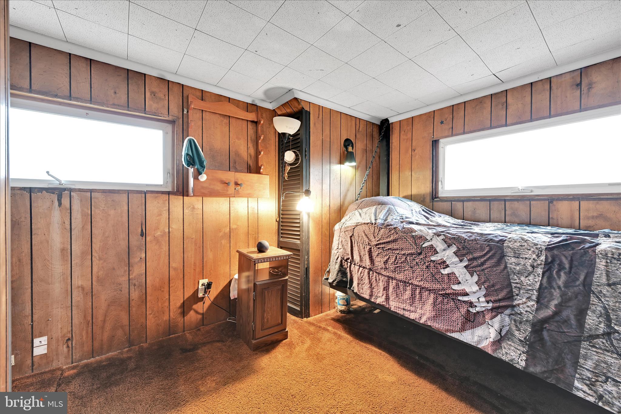 389 Sweet Arrow Lake Road Pine Grove, PA 17963 - Photo 41 of 59 a bedroom with a bed and wooden floor