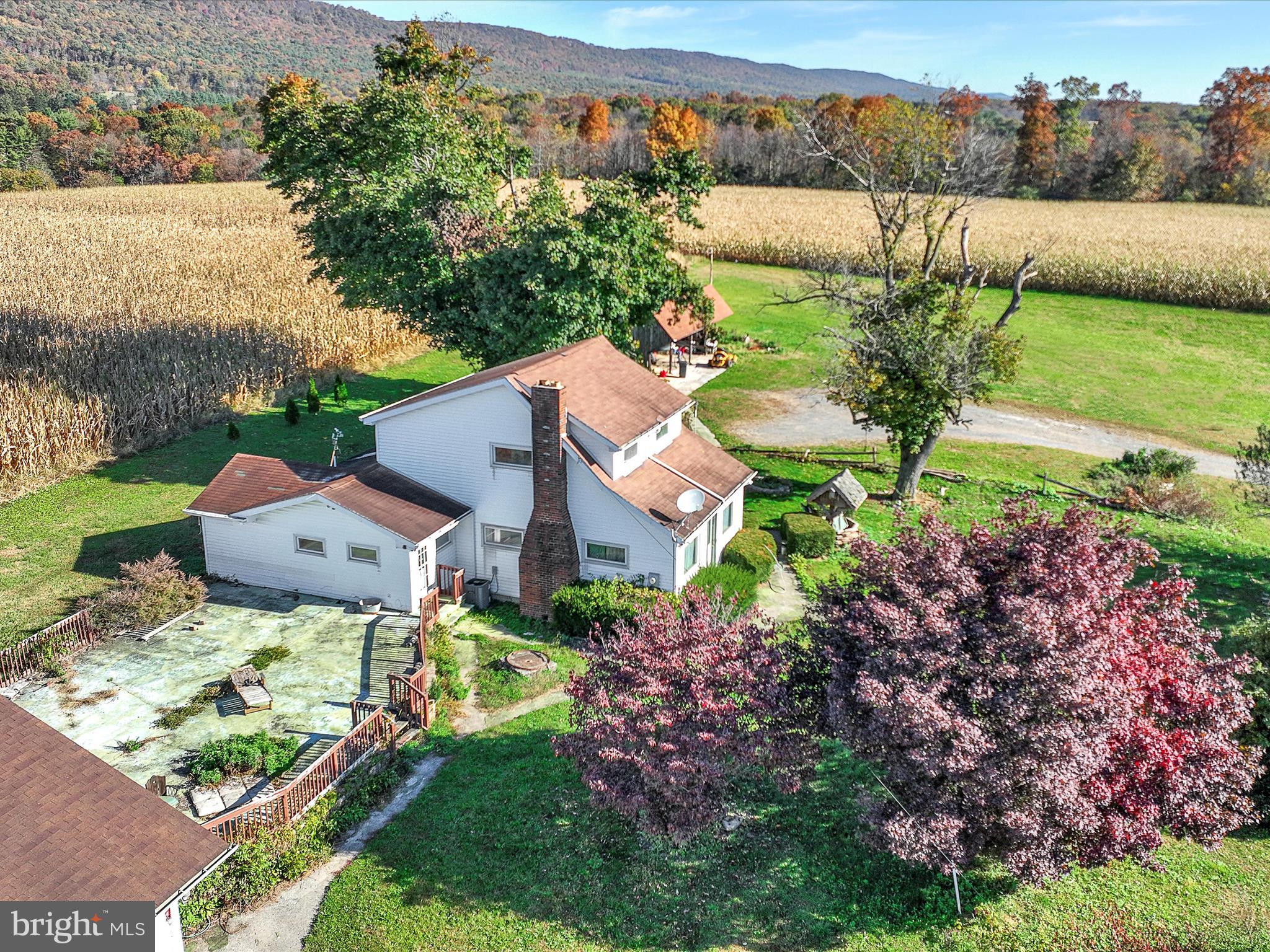 389 Sweet Arrow Lake Road Pine Grove, PA 17963 - Photo 6 of 59 an aerial view of a house with a garden and lake view