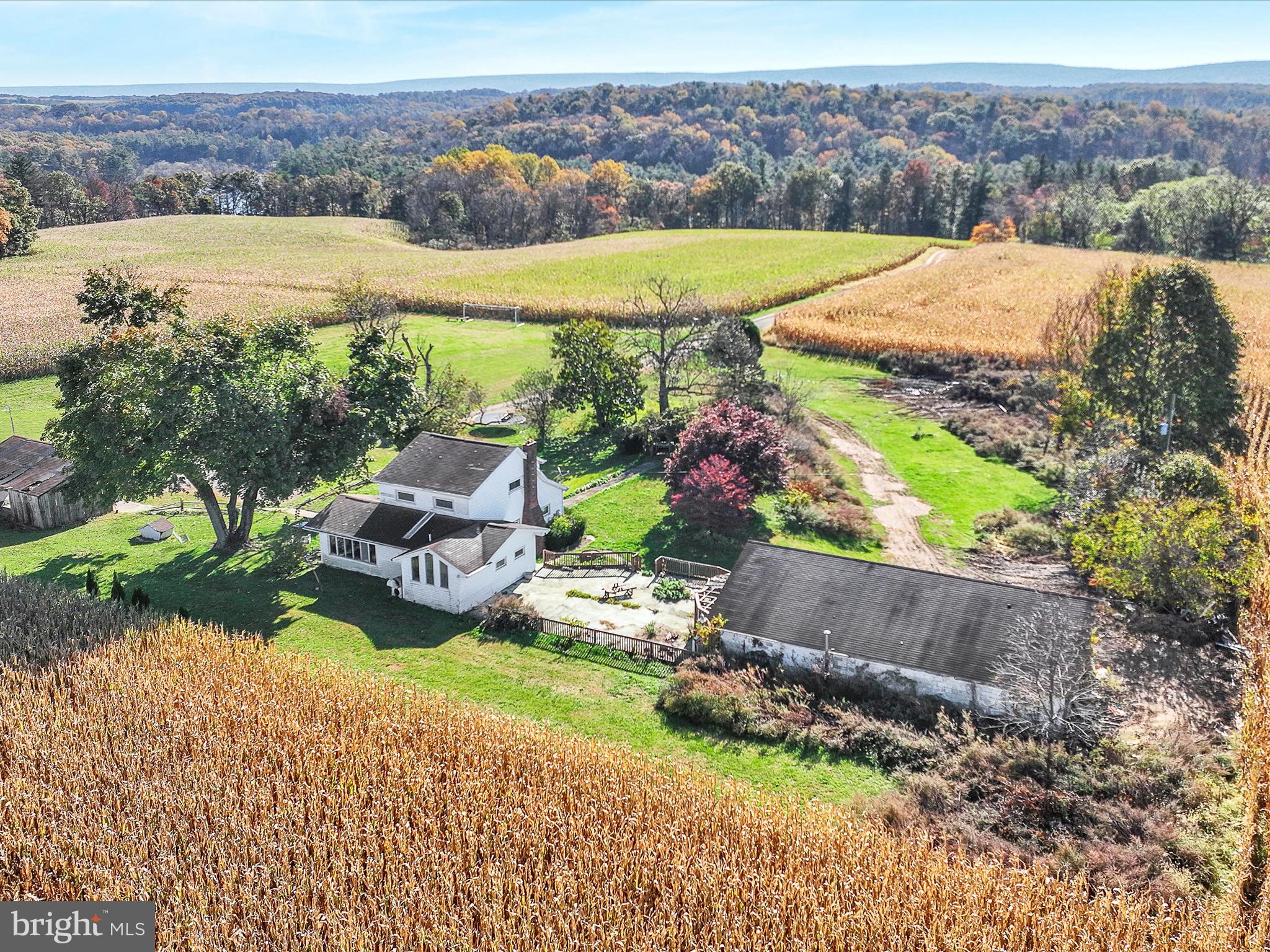 389 Sweet Arrow Lake Road Pine Grove, PA 17963 - Photo 7 of 59 an aerial view of a house with a garden and lake view