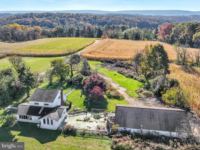 an aerial view of a house with a garden