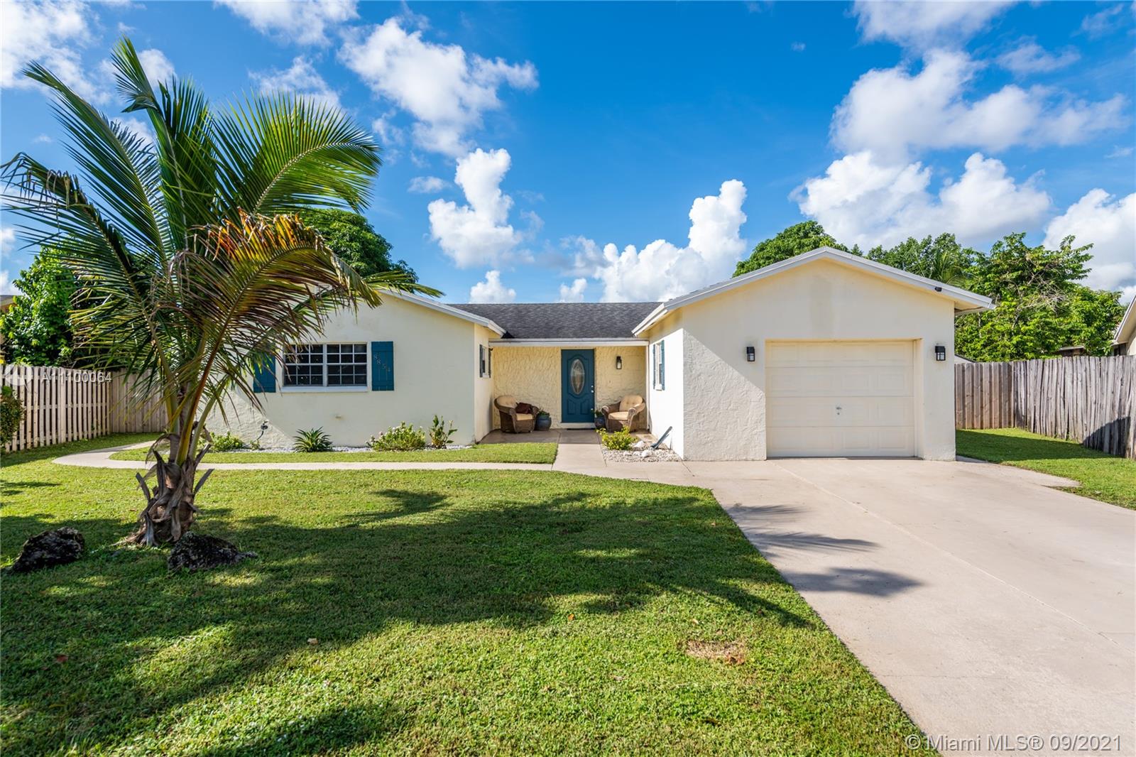 8854 Southwest 11th Street Boca Raton, FL 33433 - Photo 3 of 99 a front view of a house with a garden and outdoor seating
