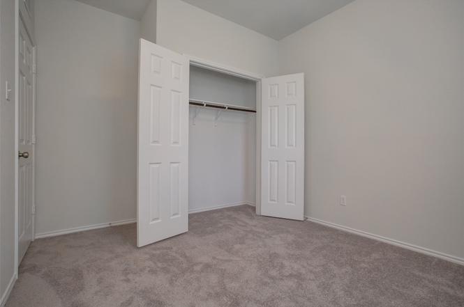 148 Spotted Rail Ridge Leander, TX 78641 - Photo 21 of 31 Ample closet space complements the serene atmosphere of this peaceful bedroom.