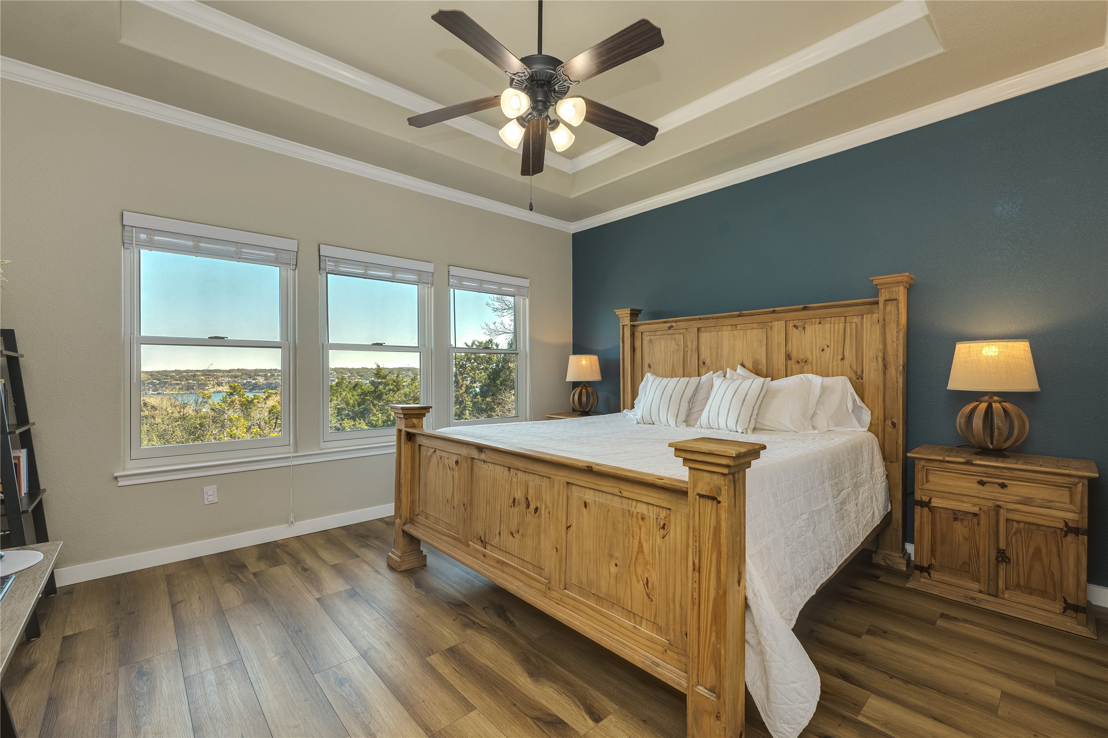 330 Southwind Road Point Venture, TX 78645 - Photo 16 of 39 The primary suite keeps the views going with the same scenery and a beautiful ensuite to match.