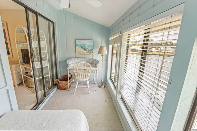 a living room with furniture and a window