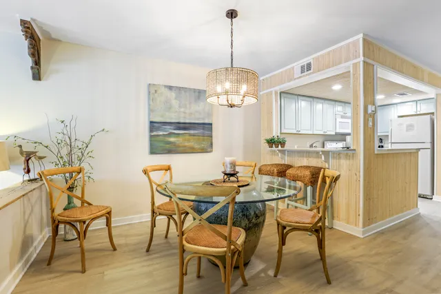 a dining room with furniture and window