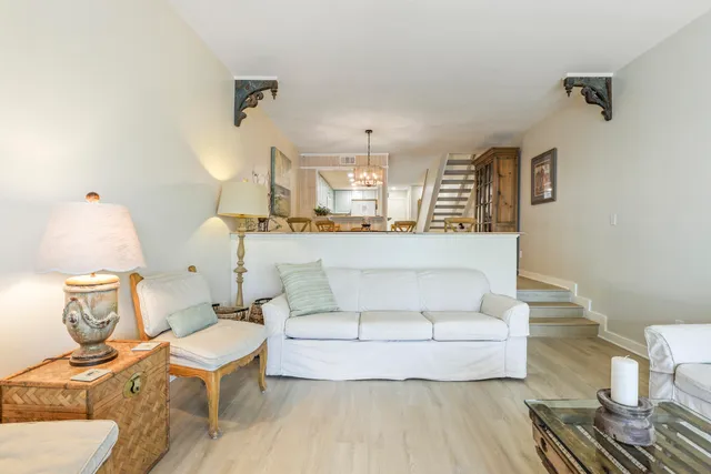 a living room with furniture and a lamp