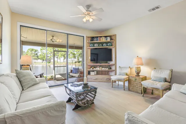 a living room with furniture fireplace and a flat screen tv