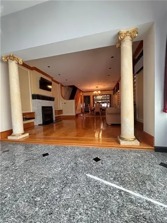 a view of a hall with wooden floor