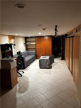 a view of a livingroom with furniture and a flat screen tv