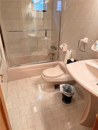 a bathroom with a sink a toilet and a bathtub