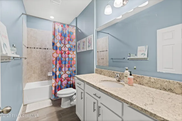a bathroom with bathtub and window