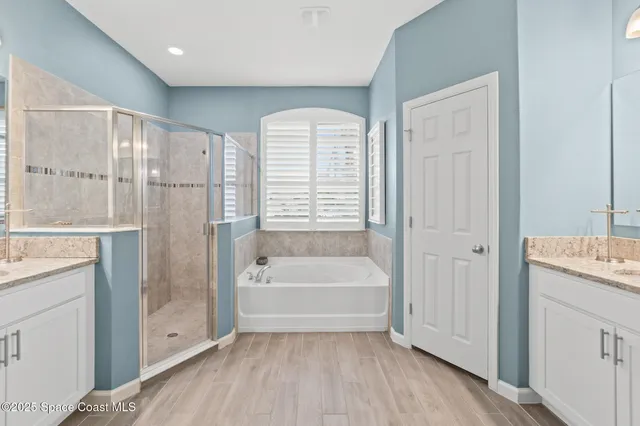 a dining room with furniture and floor to ceiling window