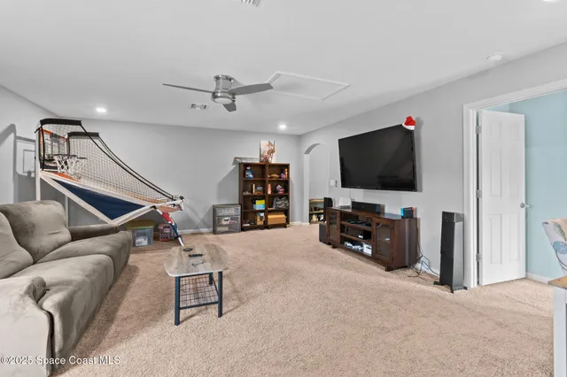 a large kitchen with stainless steel appliances kitchen island granite countertop a large counter top cabinetry a stove and a refrigerator