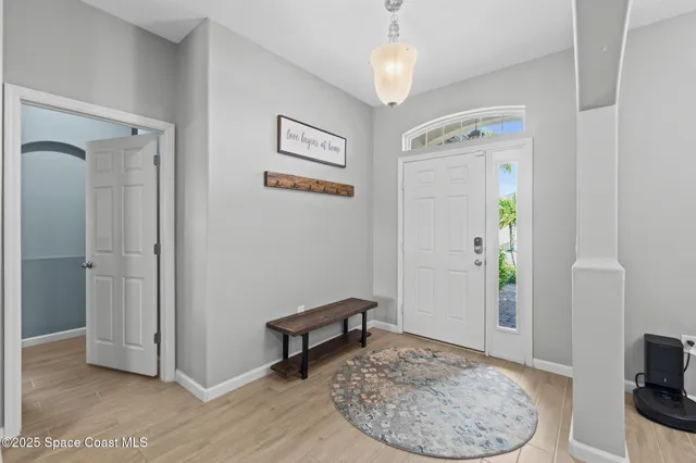 a view of a livingroom with furniture and a chandelier