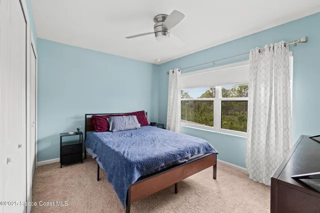 a view of a swimming pool with an outdoor space and seating area