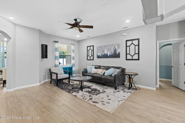 a living room with furniture a rug and a fireplace