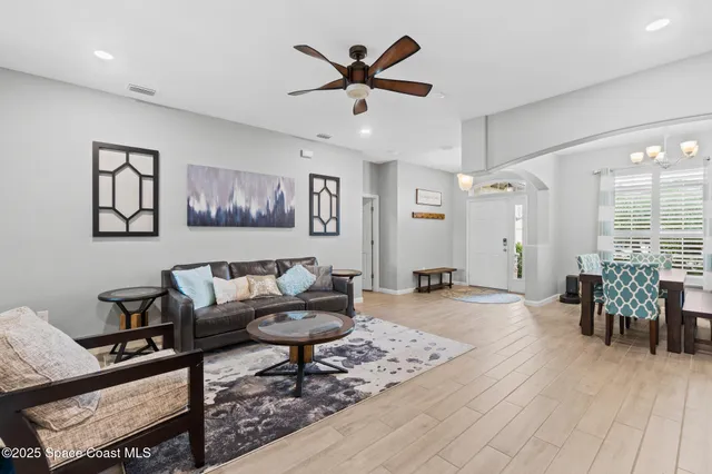 a kitchen with kitchen island a sink stove microwave and refrigerator