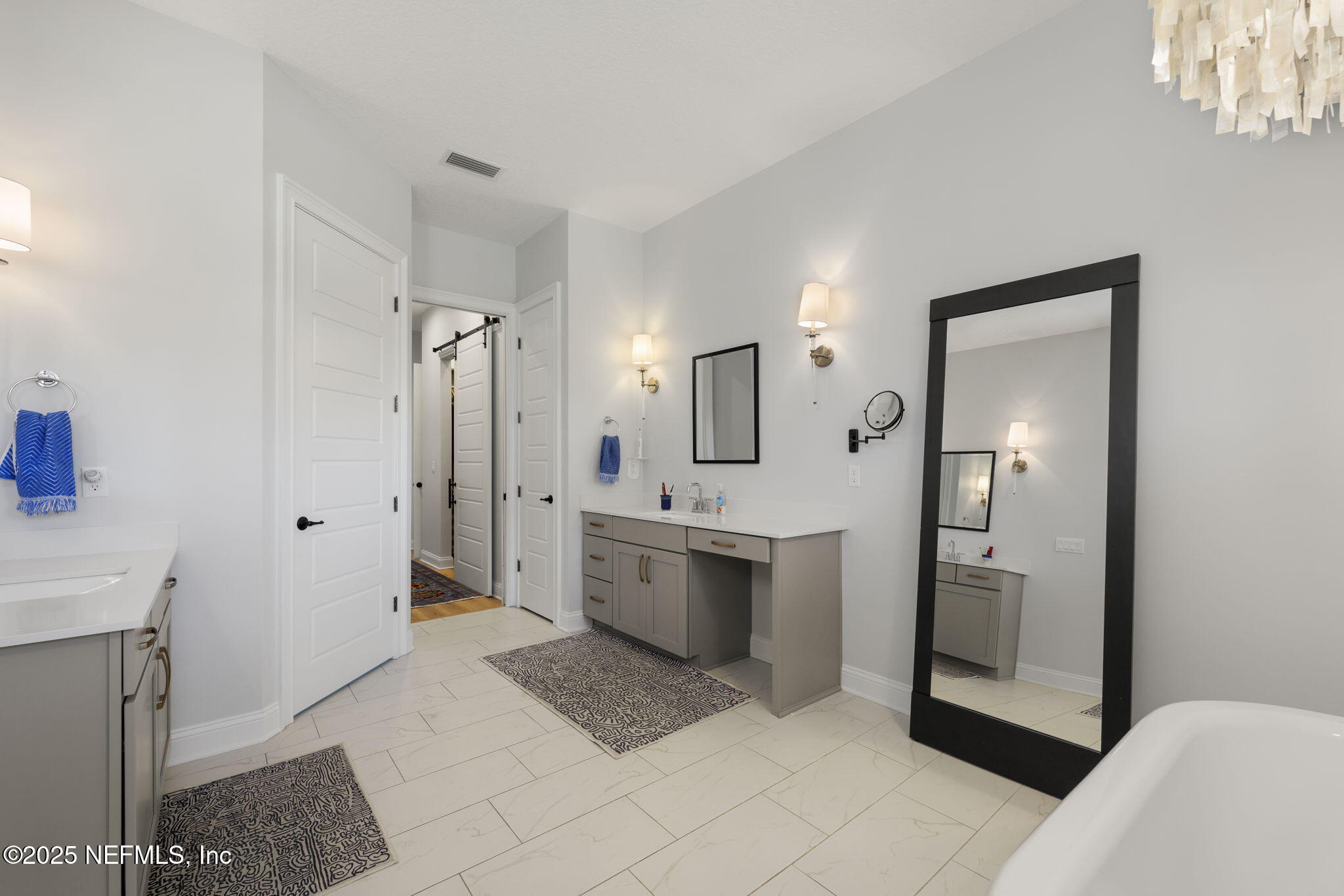 251 Vale Drive St. Augustine, FL 32095 - Photo 54 of 74 a bathroom with a sink a toilet and mirror