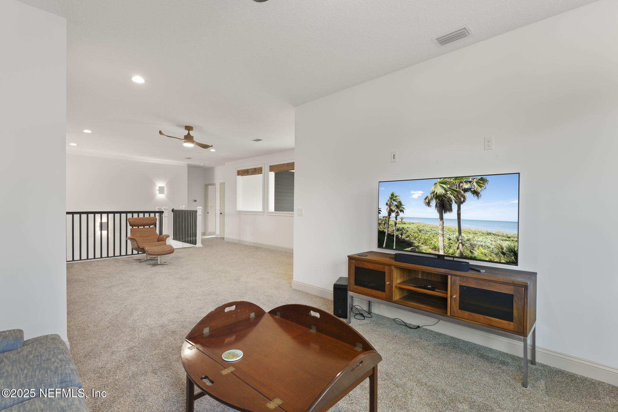 251 Vale Drive St. Augustine, FL 32095 - Photo 61 of 74 a living room with furniture and a flat screen tv