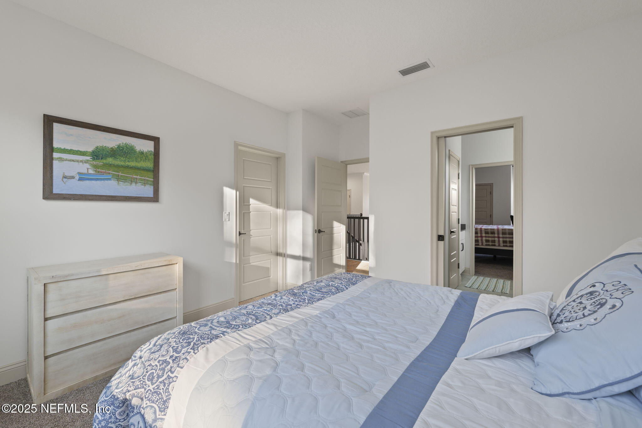 251 Vale Drive St. Augustine, FL 32095 - Photo 69 of 74 a bedroom with a bed and a painting on the wall