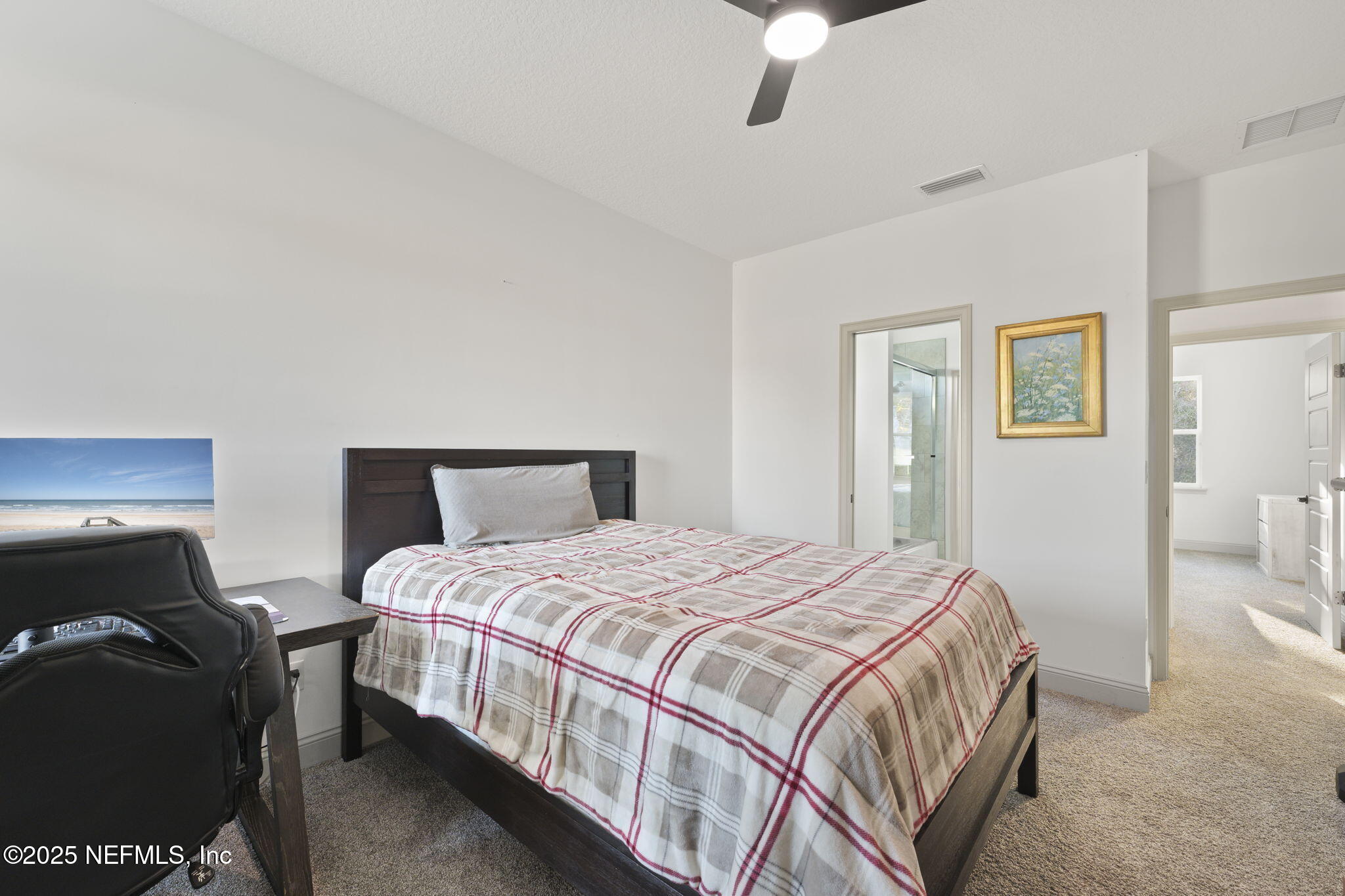 251 Vale Drive St. Augustine, FL 32095 - Photo 74 of 74 a bedroom with a bed and a night stand