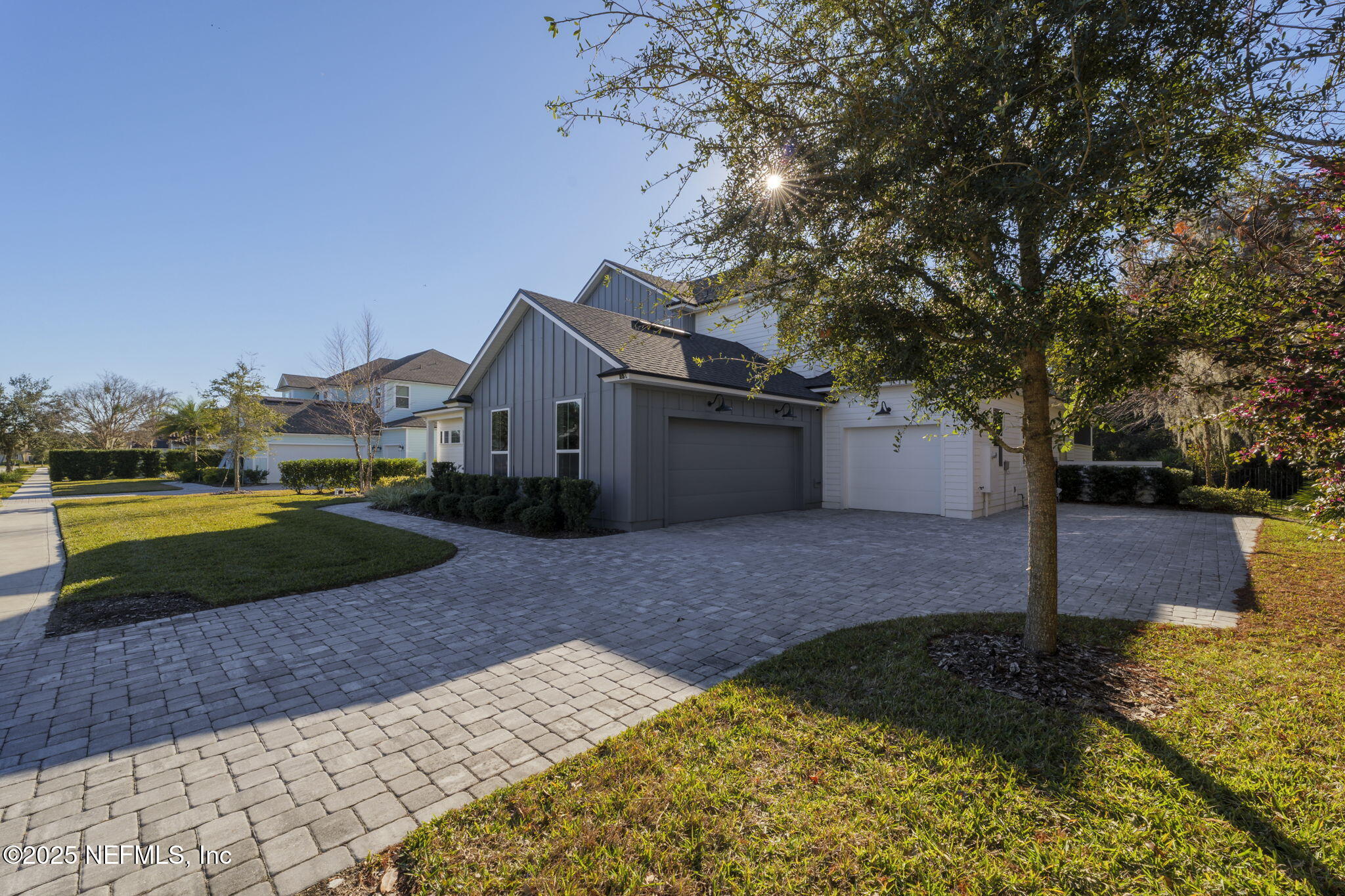 251 Vale Drive St. Augustine, FL 32095 - Photo 8 of 74 a front view of a house with a yard and a garage