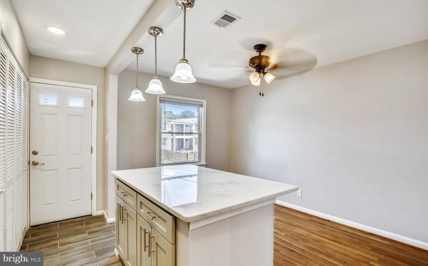 a view of a kitchen and chandelier