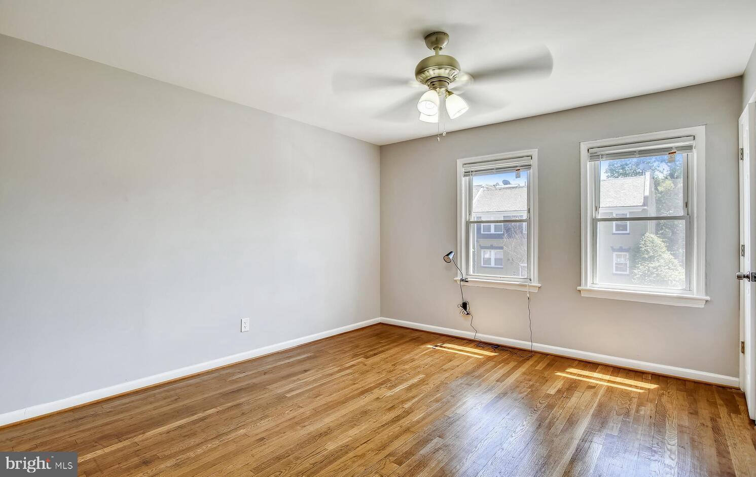 1240 Simms Place Northeast, Unit A Washington, DC 20002 - Photo 6 of 9 wooden floor in an empty room with a window