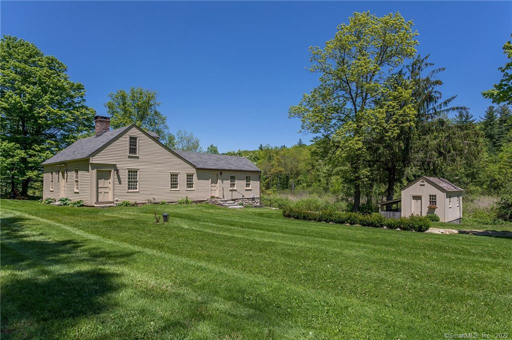 606 Milton Road Litchfield, CT 06759 - Photo 1 of 1 a house view with a garden space