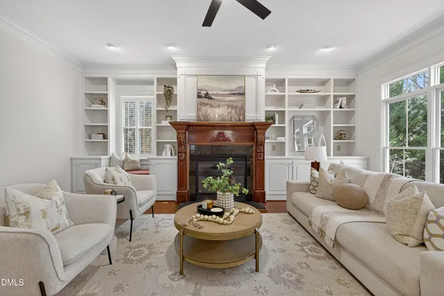 a large bedroom with a bed and a fireplace