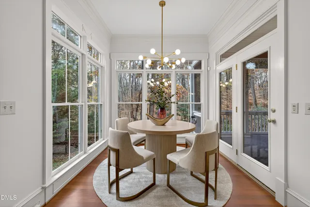 a living room with furniture a lamp and a window