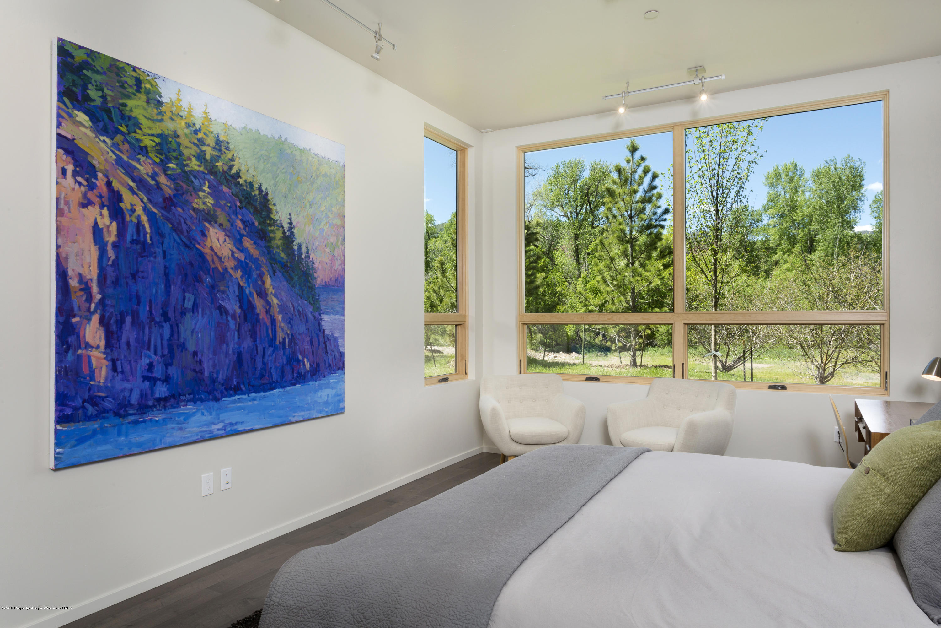 100 Evans Road, Unit 202 Basalt, CO 81621 - Photo 13 of 25 a bedroom with furniture and a large window